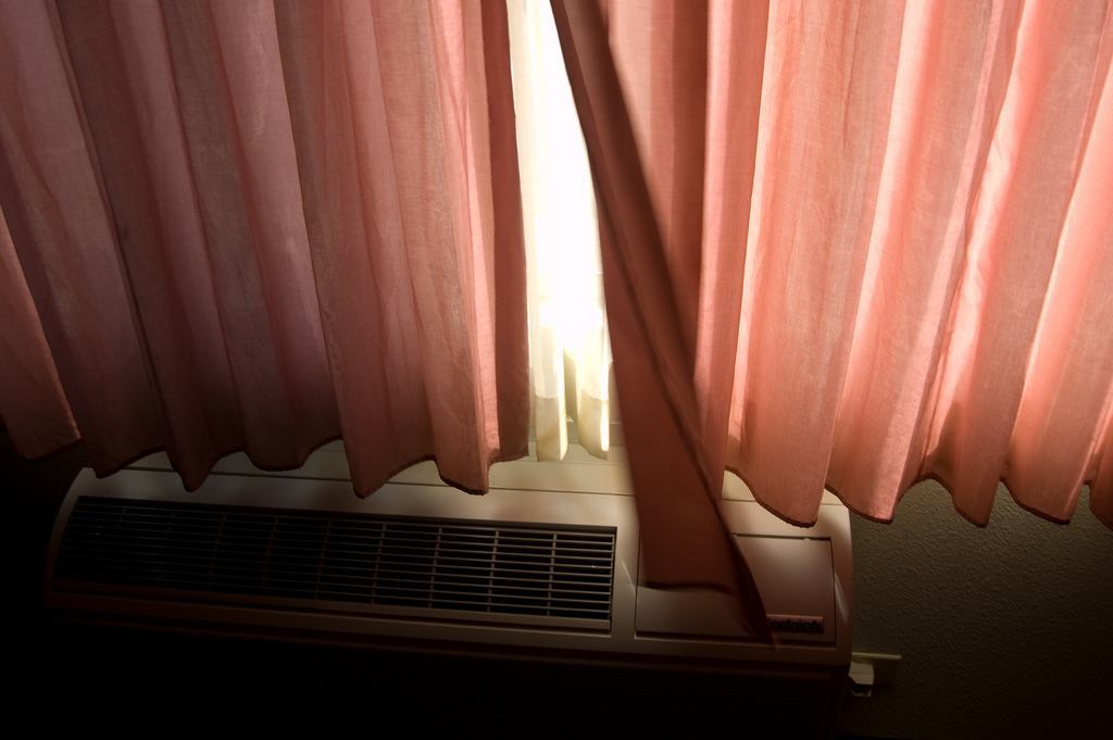 Drawn curtains blocking out sunlight